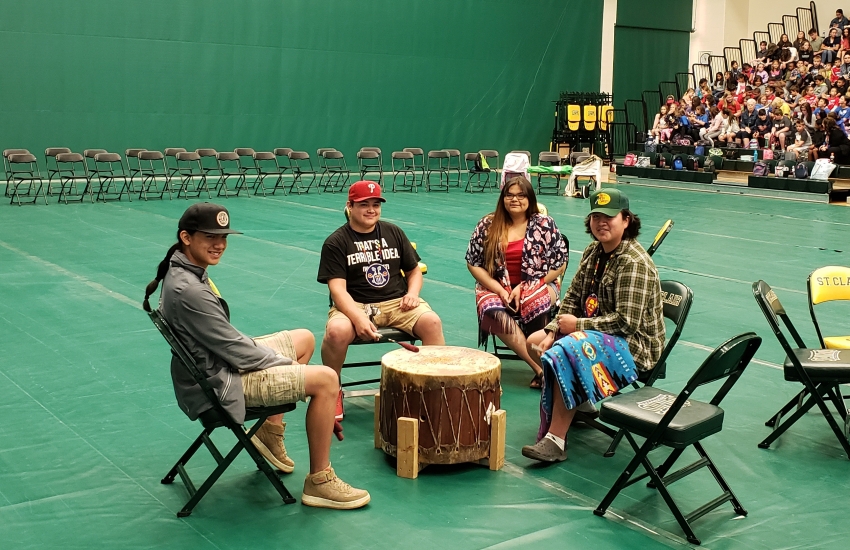 Powwow drum and people sitting around it